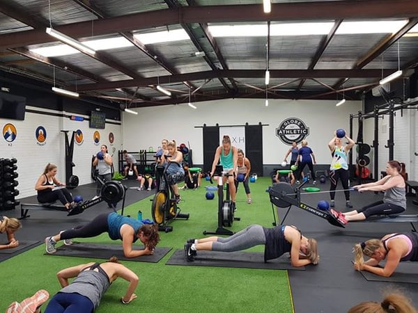 Group of people doing circuit training 