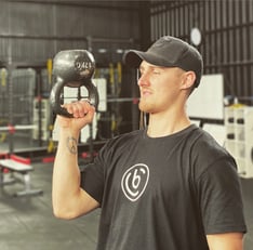 Zack Loxley working out with kettle ball 