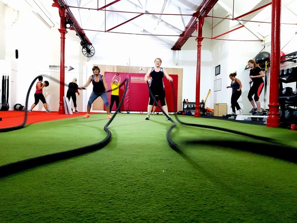 two women doing rope workout 