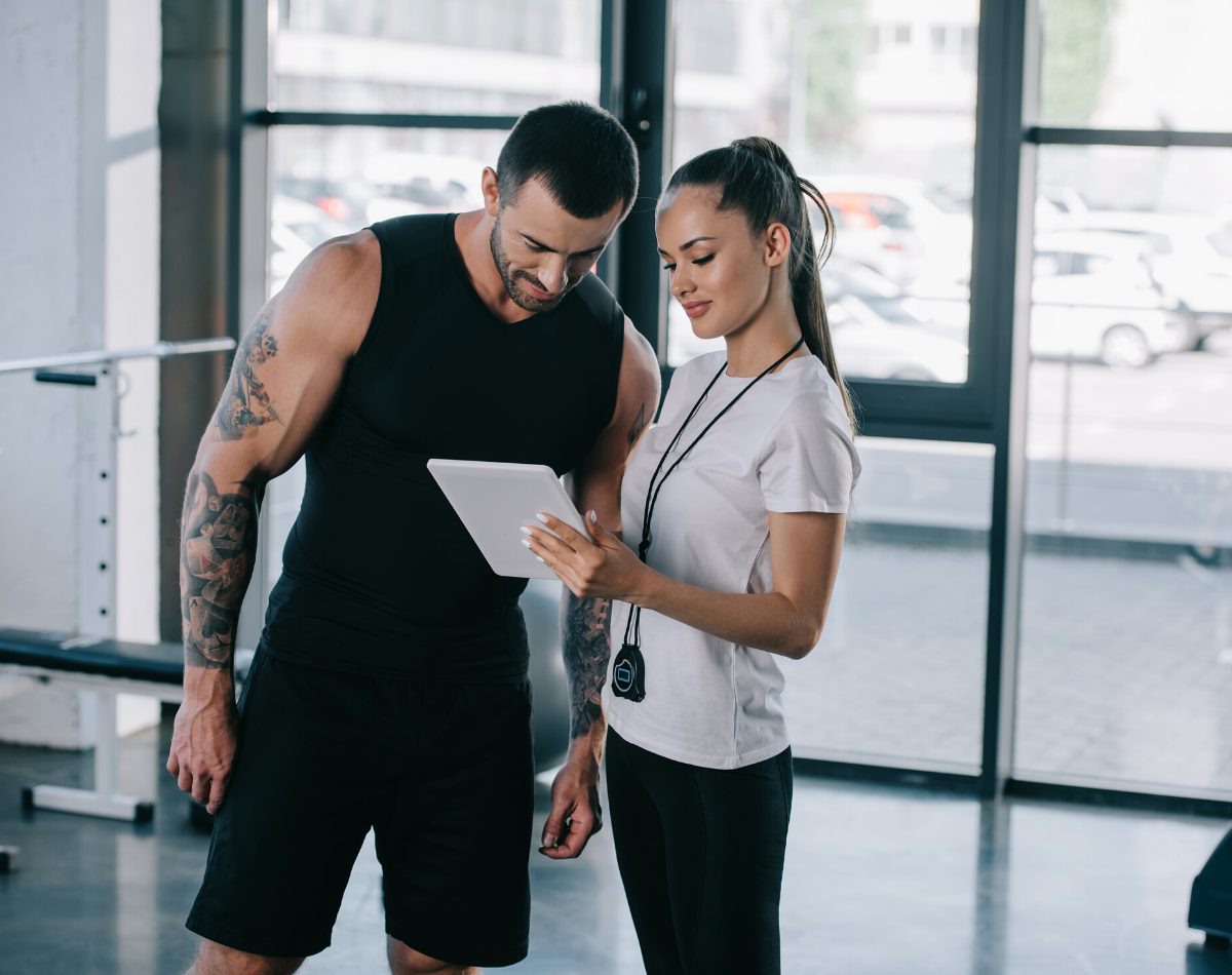 A female personal trainer with a client